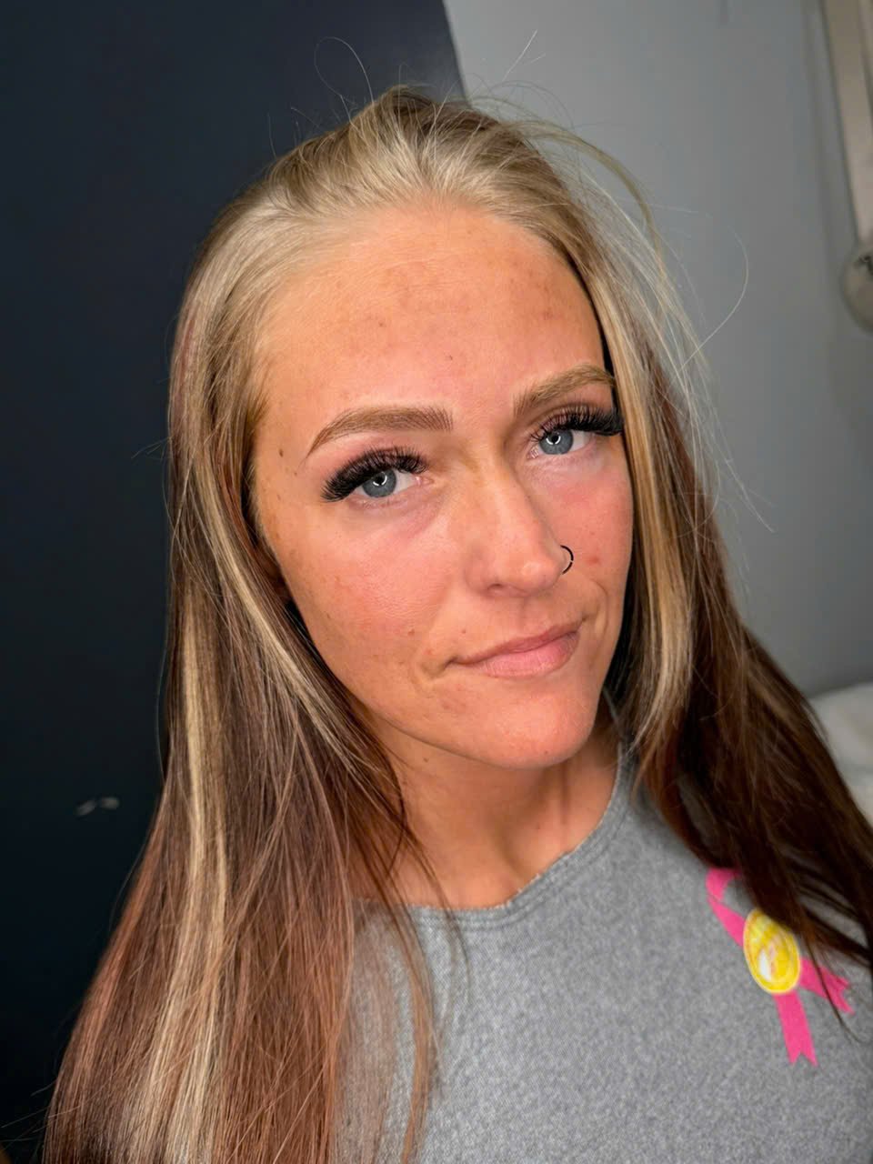 Client smiling after a lash fill at Fairy Lashes & Brows in Nederland, TX